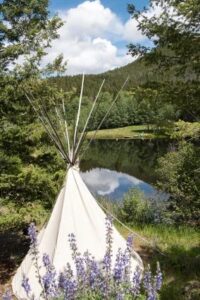 Indian Teepee near lake at Feathered Pipe Ranch in Montana.