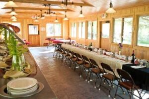 Long dining table in restaurant at Feathered Pipe Ranch in Montana.