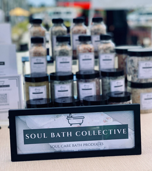 Soul Bath Collective display showing essential oils and other natural products for body and home.