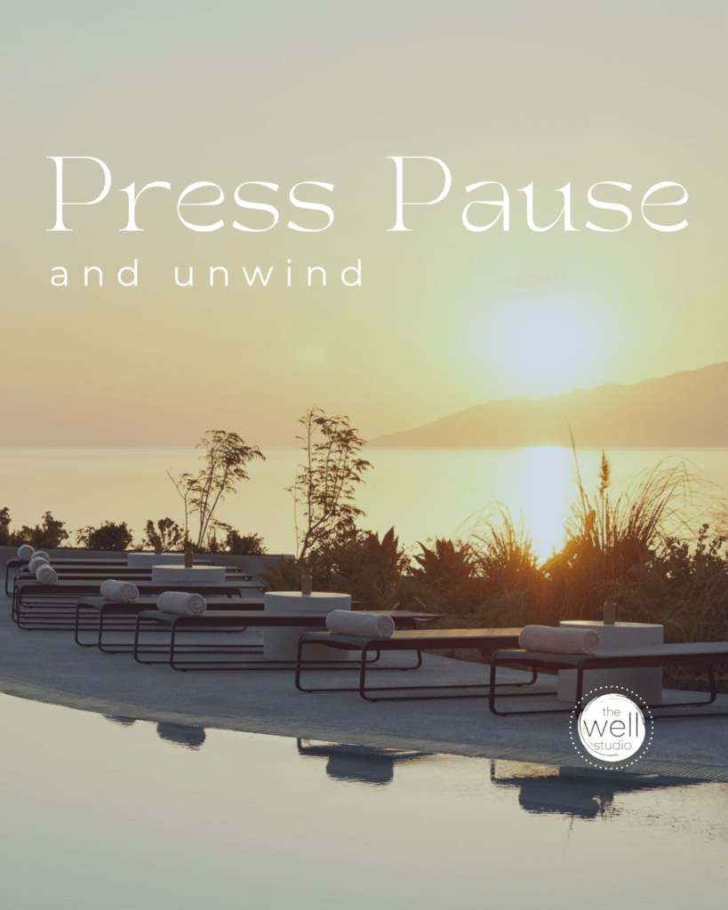 A pool at a luxury resort at sunset with the Aegean Sea in the background. Text overlay "Press pause and unwind"