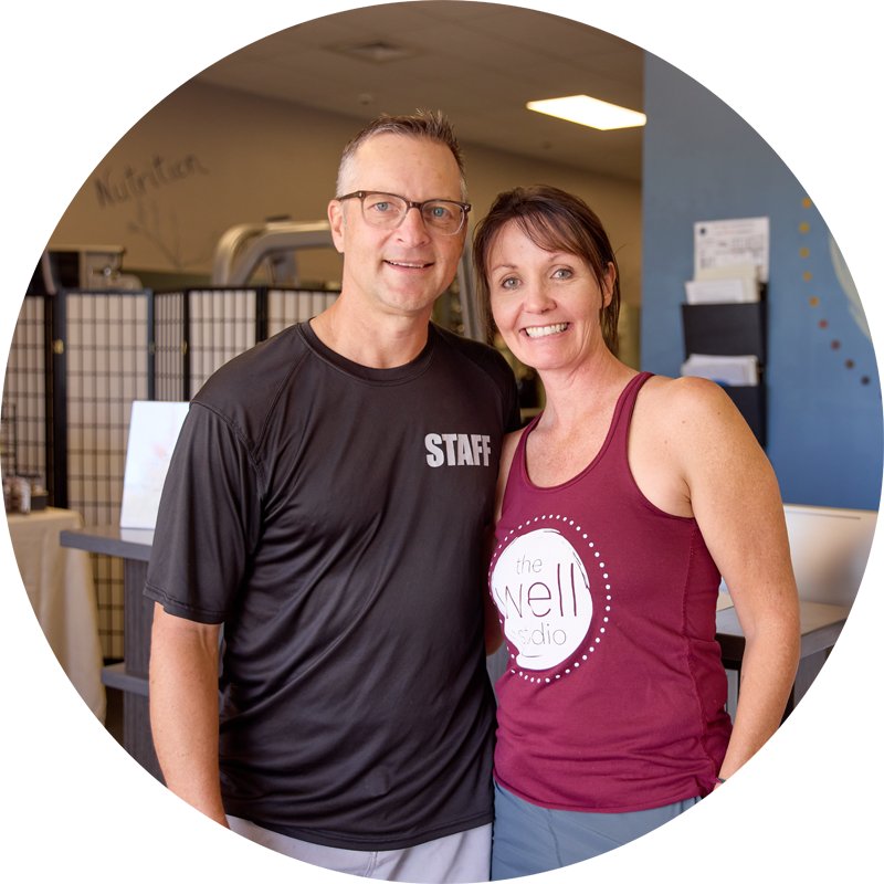 Well Studio founders, Ron & Stacy, smile and pose in the Well Studio lobby.